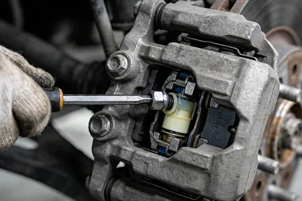 rear brake caliper sticks after replacement parking brake inspection